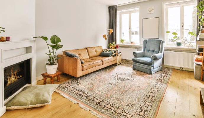 Rug placed on hardwood floor.